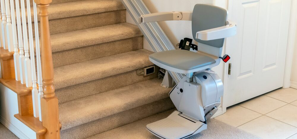 A Stairlift at the bottom of the stairs. An example of the best stair lift for the customers stairs.